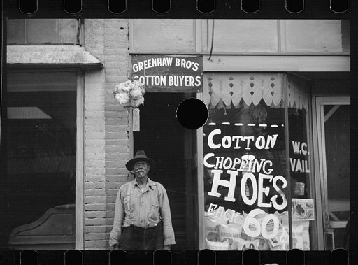 Untitled photo, possibly related to: Typical view of store and cotton trader in small Arkansas town. This one made in Marianna, Arkansas