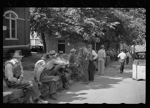 Loafers' wall, at courthouse, Batesville, Arkansas. Here from sun up until well into the night these fellows, young and old, "set". Once a few years ago a political situation was created when an attempt was made to remove the wall. It stays. When asked what they do there all day, one old fellow repl