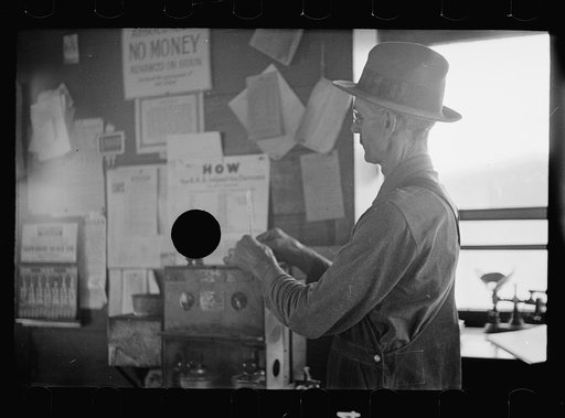 Untitled photo, possibly related to: Testing the quality of corn at grain elevator before price is decided upon for the farmer, near Gibson City, Illinois