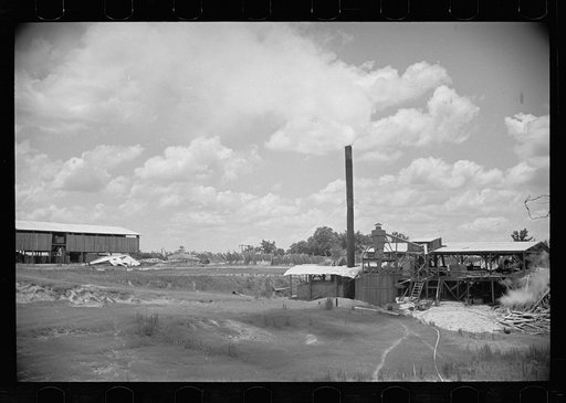 Untitled photo, possibly related to: Clover farmer on seed threshing machine, St. Charles Parish, Louisiana