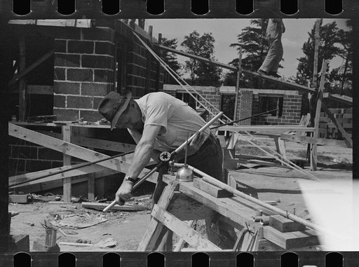 Plumber cutting pipe, Greenbelt, Maryland