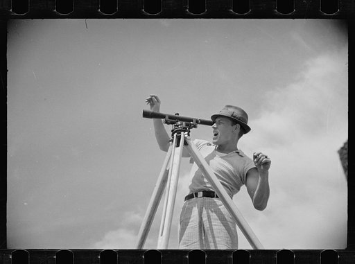 Untitled photo, possibly related to: Surveyor working in a model community planned by the Suburban Division of the United States Resettlement Administration, Greenbelt, Maryland