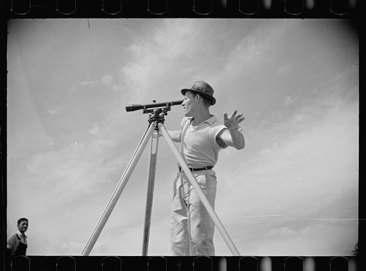 Surveyor working in a model community planned by the Suburban Division of the United States Resettlement Administration, Greenbelt, Maryland