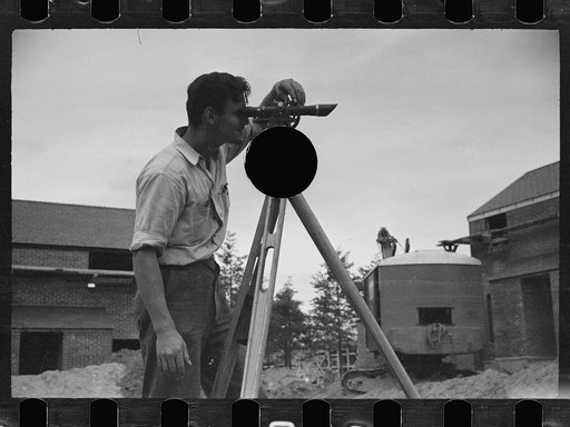 Untitled photo, possibly related to: Surveyor working in a model community planned by the Suburban Division of the United States Resettlement Administration, Greenbelt, Maryland
