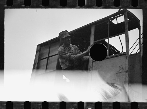 Untitled photo, possibly related to: Unloading pipe with crane, Greenbelt, Maryland