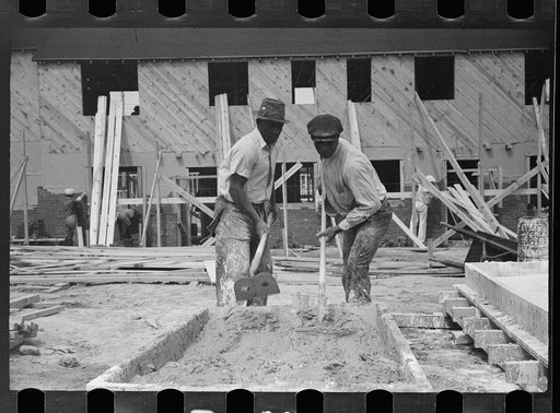 Untitled photo, possibly related to: Worker leveling cement floor, Greenbelt, Maryland