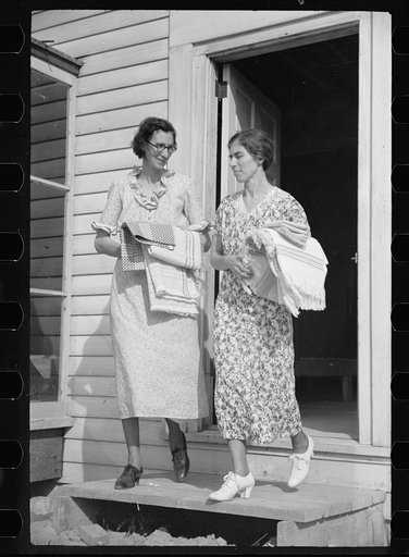 Homesteaders carrying shawls, etc., woven at Tygart Valley Homesteads, West Virginia