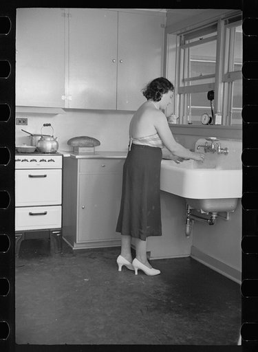 Untitled photo, possibly related to: Hightstown homesteader in the kitchen of her new home, New Jersey