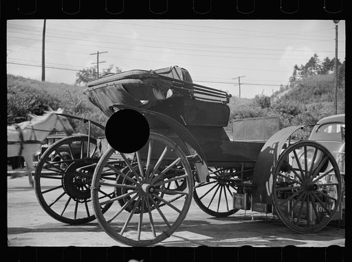 Untitled photo, possibly related to: Old horseless carriage at gasoline station near Lost River, New Hampshire