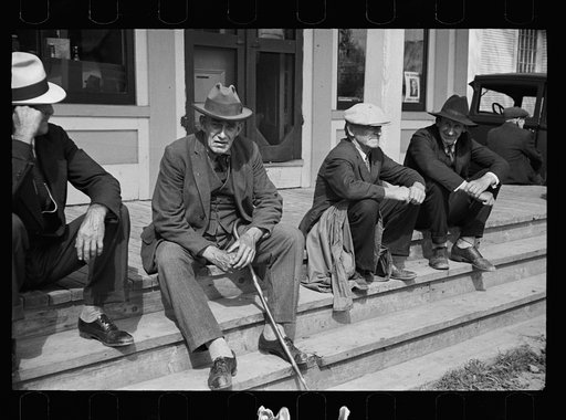 Fair at Albany, Vermont. The old timers take to the steps of the general store