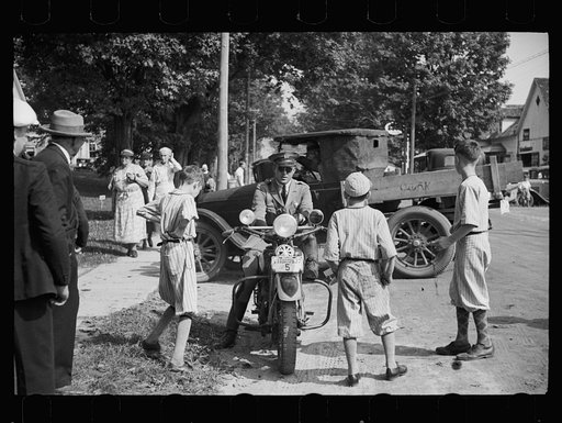 The "state cop" is the young boy's idol. Fair at Albany, Vermont