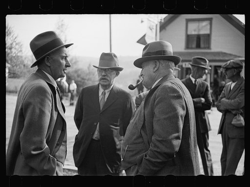 Untitled photo, possibly related to: Fair at Albany, Vermont. The old timers take to the steps of the general store