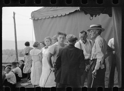 The county sheriff in "cahoots" with the carnival clown, talking a victim of $16.00 loss into a considerable reduction, "back of the tent" at the Morrisville, Vermont annual fair