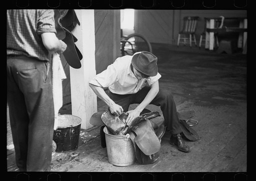 Scrubbing saddle at Eastern States Fair. Springfield, Massachusetts