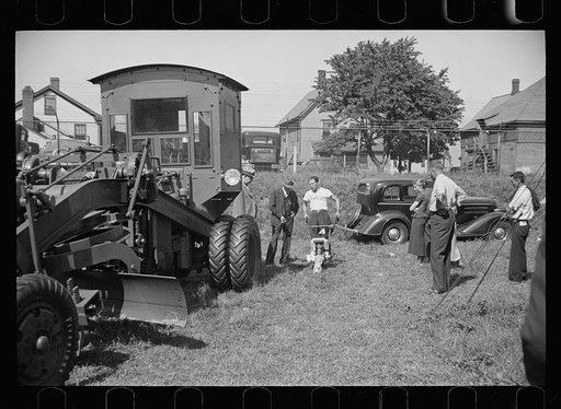 Untitled photo, possibly related to: Practical exhibition of farm equipment always finds the interested, Springfield, Massachusetts