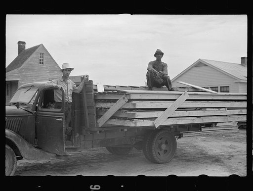 Truck loaded with parts of prefabricated house, Roanoke Farms, North Carolina