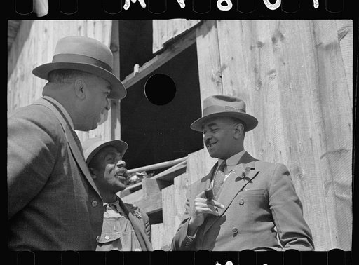 Untitled photo, possibly related to: Nat Williamson with Negro  county agent and vocational director. Williamson has received a loan under the Tenant Purchase Program, North Carolina
