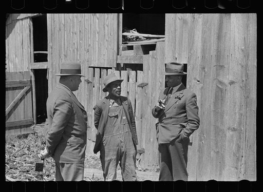 Nat Williamson with Negro  county agent and vocational director. Williamson has received a loan under the Tenant Purchase Program, North Carolina