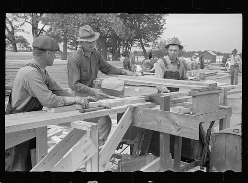At work on prefabricated house, Roanoke Farms, North Carolina