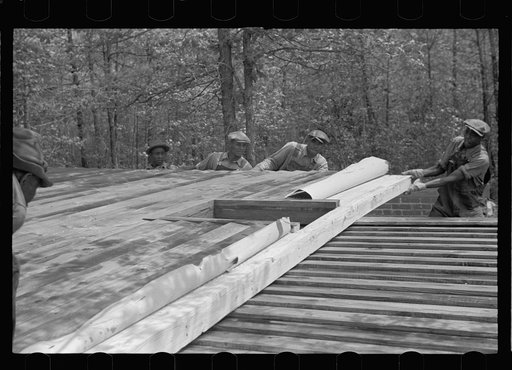 Unloading wall of prefabricated house, Roanoke Farms, North Carolina
