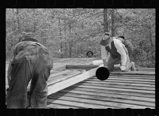 Untitled photo, possibly related to: Unloading wall of prefabricated house, Roanoke Farms, North Carolina