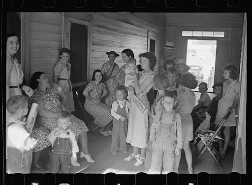 Women and children waiting to see the doctor, who visits the project once a week. Irwinville Farms, Georgia