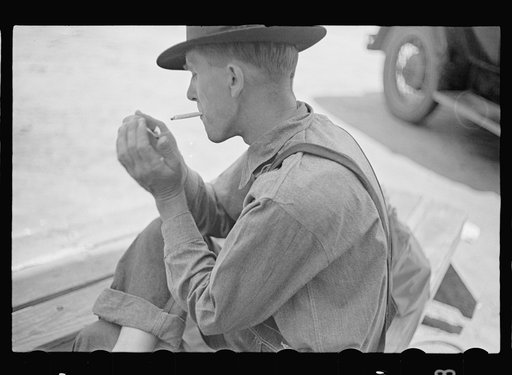 Untitled photo, possibly related to: Rolling a cigarette. Irwinville Farms, Georgia