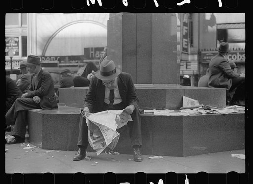 Man reading newspaper in Fountain Square, Cincinnati, Ohio