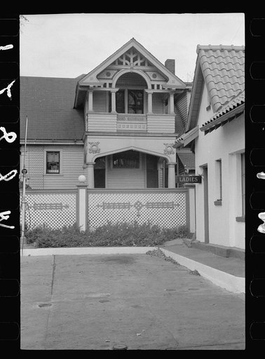 Gas station on Dodge Street encroaching on private home, Omaha, Nebraska