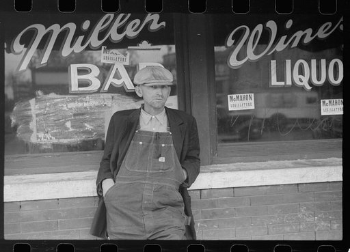 Man in front of saloon in stockyard district, South Omaha, Nebraska