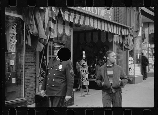 Untitled photo, possibly related to: Policeman talking with group of men, South Omaha, Nebraska