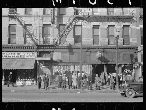 Untitled photo, possibly related to: Men talking in front of saloon on lower Douglas Street, Omaha, Nebraska