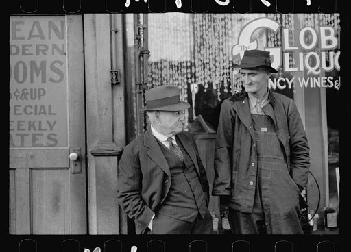 Men talking in front of saloon on lower Douglas Street, Omaha, Nebraska