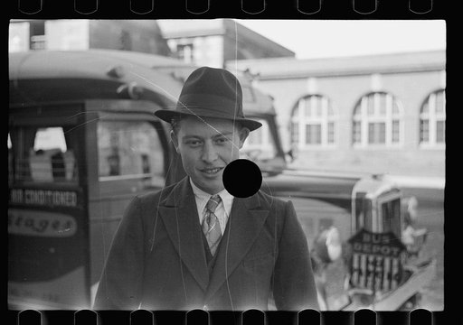 Untitled photo, possibly related to: Boy in front of the bus depot. Grand Island, Nebraska