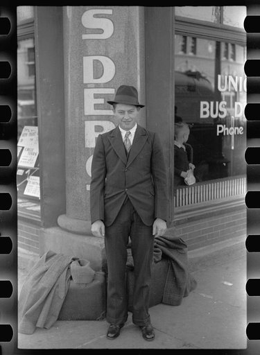 Boy in front of the bus depot. Grand Island, Nebraska