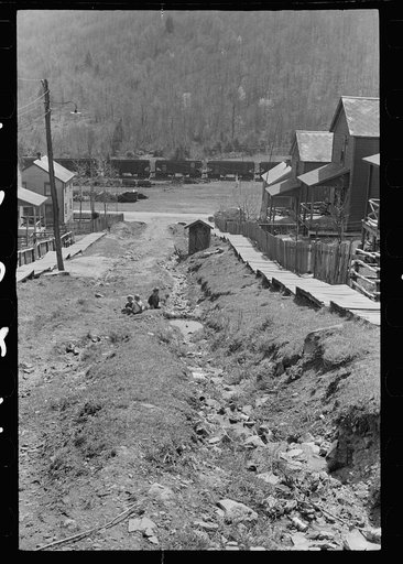 Children playing in street of company town, Kempton, West Virginia. Note open ditches