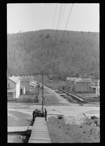 Striking coal miners sitting on the boardwalk, during May 1939 coal strike.  Kempton, West Virginia
