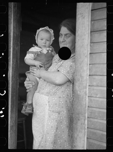 Untitled photo, possibly related to: Wife of coal miner with grandchild. Kempton, West Virginia