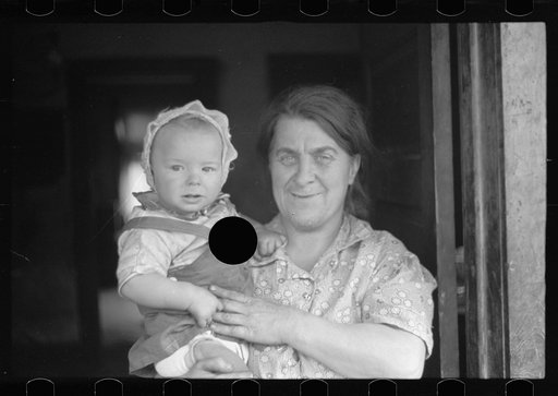 Untitled photo, possibly related to: Wife of coal miner with grandchild. Kempton, West Virginia
