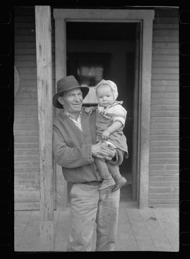 Italian coal miner with his grandchild, Kempton, West Virginia