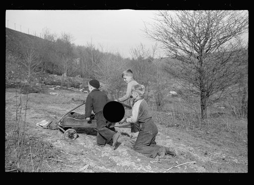 Untitled photo, possibly related to: Miner's sons bringing home coal which they have salvaged from slag pile.  Kempton, West Virginia