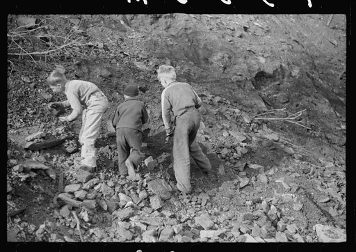Miner's sons getting coal from the slag pile during May 1939 coal strike.  Kempton, West Virginia