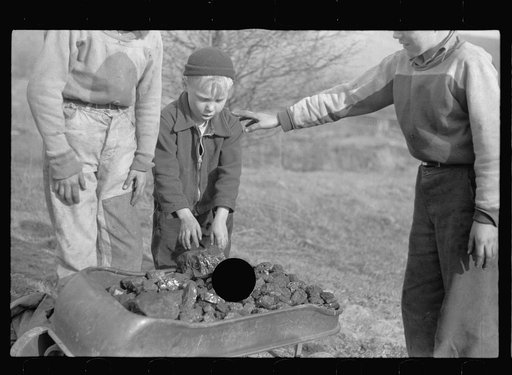Untitled photo, possibly related to: Miner's sons getting coal from the slag pile during May 1939 coal strike.  Kempton, West Virginia