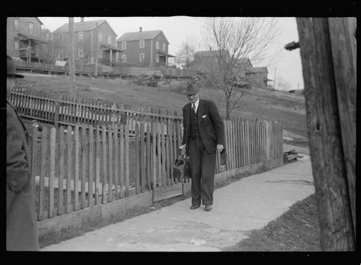 Company doctor leaving home of sick miner. Kempton, West Virginia