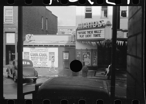 Untitled photo, possibly related to: Movie theatre, Elkins, West Virginia. There are two movies in town, both offer games of chance three nights a week to drum up trade on slack nights