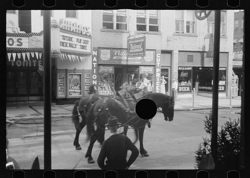 Untitled photo, possibly related to: Movie theatre, Elkins, West Virginia. There are two movies in town, both offer games of chance three nights a week to drum up trade on slack nights