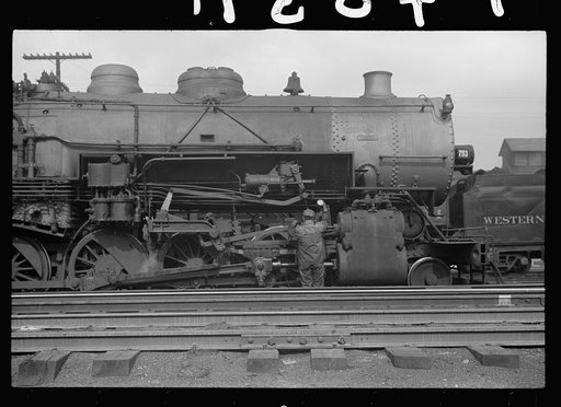 Yard brakeman oiling locomotive, Elkins, West Virginia