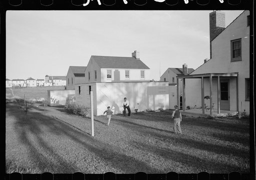 Father and sons playing ball, Greendale, Wisconsin