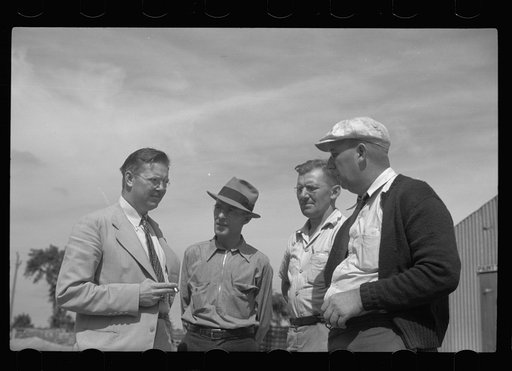 Assistant community manager talking with members of maintenance crew, Greendale, Wisconsin