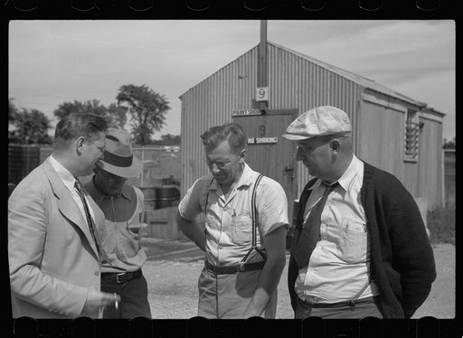 Untitled photo, possibly related to: Assistant community manager talking with members of maintenance crew, Greendale, Wisconsin